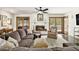 Cozy living room featuring a brick fireplace, wood floors, and ample natural light with stylish decor and furnishings at 2452 Camp Mitchell Rd, Grayson, GA 30017
