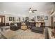 Bright and airy living room showcasing a large sectional, hardwood floors, and inviting decor at 2452 Camp Mitchell Rd, Grayson, GA 30017