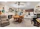 Cozy living room seamlessly blends with a charming kitchen, complete with a fireplace and dining area for comfortable living at 2452 Camp Mitchell Rd, Grayson, GA 30017