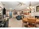 Spacious living room features a dining area, musical instruments, and comfortable seating, perfect for entertaining and relaxation at 2452 Camp Mitchell Rd, Grayson, GA 30017