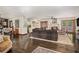 Open-concept living area showcasing the fireplace, hardwood floors, and natural light at 2452 Camp Mitchell Rd, Grayson, GA 30017