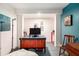 Finished basement area offers flexible space as an office with brightly colored accent wall at 2452 Camp Mitchell Rd, Grayson, GA 30017