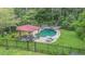 Backyard view of the in-ground pool area with a covered gazebo at 2452 Camp Mitchell Rd, Grayson, GA 30017