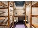 Home space with wooden storage shelving, work area, purple flooring, and recessed lighting at 2452 Camp Mitchell Rd, Grayson, GA 30017