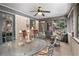 Inviting sunroom with comfortable seating, ceiling fan and tranquil views at 2452 Camp Mitchell Rd, Grayson, GA 30017