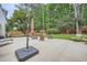 Spacious concrete back patio with outdoor furniture and landscaped yard perfect for relaxing at 2917 Townley Cir, Atlanta, GA 30340