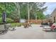 Backyard with patio, lounge furniture, storage shed, privacy fence, and mature trees at 2917 Townley Cir, Atlanta, GA 30340