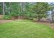 Manicured lawn and wooded perimeter in the large backyard of this property creates a serene, private space at 2917 Townley Cir, Atlanta, GA 30340