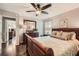 Bedroom with a sleigh bed, hardwood floors, and views to the ensuite bathroom and closet at 2917 Townley Cir, Atlanta, GA 30340