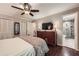 View of bedroom, closet doors, dresser, and ensuite bathroom with glass shower at 2917 Townley Cir, Atlanta, GA 30340
