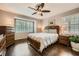 Bedroom features hardwood floors and windows with plantation shutters at 2917 Townley Cir, Atlanta, GA 30340