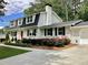 Beautifully landscaped home with a red front door and a two-car garage at 2917 Townley Cir, Atlanta, GA 30340