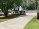 Charming home features a bright red door, a two-car garage, and mature trees at 2917 Townley Cir, Atlanta, GA 30340