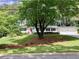 A large tree sits in the front yard of a charming home with a two-car garage at 2917 Townley Cir, Atlanta, GA 30340