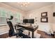 Bright home office featuring modern desk, dual monitors, and stylish decor at 2917 Townley Cir, Atlanta, GA 30340