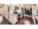Well-lit kitchen with stainless steel appliances and granite countertops, seamlessly connected to the office at 2917 Townley Cir, Atlanta, GA 30340