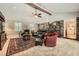 Spacious living room with exposed brick accent wall, beamed ceiling, and cozy furniture at 2917 Townley Cir, Atlanta, GA 30340