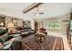 Large living room featuring exposed beams, brick accent wall, and comfortable seating at 2917 Townley Cir, Atlanta, GA 30340