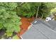 Aerial view of a backyard featuring lush greenery and a storage shed at 3751 Cherokee Se Pl, Marietta, GA 30067