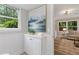 Bright, tastefully decorated bathroom featuring wainscoting and a convenient storage cabinet at 3751 Cherokee Se Pl, Marietta, GA 30067