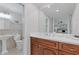 Bathroom featuring double sinks, modern fixtures, and large mirror at 3751 Cherokee Se Pl, Marietta, GA 30067