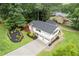 Aerial view of a two-story home with a spacious driveway, manicured lawn and beautiful landscaping at 3751 Cherokee Se Pl, Marietta, GA 30067