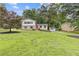 Charming two-story home with lush lawn and a detached garage in a serene, wooded setting at 3751 Cherokee Se Pl, Marietta, GA 30067