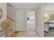 Inviting foyer features wood-look flooring, neutral walls, and views into the bright, white kitchen at 3751 Cherokee Se Pl, Marietta, GA 30067