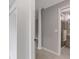 Hallway view of walk-in closet and renovated bathroom with glass shower at 3751 Cherokee Se Pl, Marietta, GA 30067
