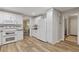 Well-lit kitchen featuring white cabinets, modern appliances, and an adjacent dining area at 3751 Cherokee Se Pl, Marietta, GA 30067