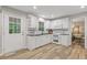 Bright kitchen with white cabinets, stainless steel appliances, and hardwood floors at 3751 Cherokee Se Pl, Marietta, GA 30067