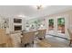Inviting living room featuring a fireplace, built-in shelves, and french doors to the backyard at 3751 Cherokee Se Pl, Marietta, GA 30067