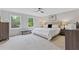 Serene main bedroom filled with light from two windows featuring neutral tones and comfortable carpeting at 3751 Cherokee Se Pl, Marietta, GA 30067