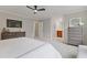 Spacious main bedroom featuring an ensuite bath, ceiling fan, and TV at 3751 Cherokee Se Pl, Marietta, GA 30067