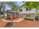 Backyard features a screen porch, brick accents, and mature trees at 3751 Cherokee Se Pl, Marietta, GA 30067