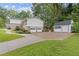 Exterior view of the home featuring a shed, two-car garage, and well-manicured lawn at 3751 Cherokee Se Pl, Marietta, GA 30067