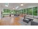 Bright sun room features a vaulted ceiling, skylights, and lots of windows overlooking the backyard at 3751 Cherokee Se Pl, Marietta, GA 30067