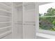 Spacious walk-in closet with shelving and a window bringing in natural light at 3751 Cherokee Se Pl, Marietta, GA 30067