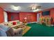 Finished basement featuring plush green carpet, comfortable seating, and entertainment center at 40 Oak Hill Dr, Covington, GA 30016