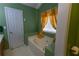 Cozy bathroom featuring a tub, window, and coordinated design at 40 Oak Hill Dr, Covington, GA 30016