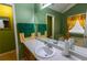 Well lit bathroom featuring double sink, bathtub and large mirror at 40 Oak Hill Dr, Covington, GA 30016