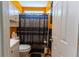 Well lit bathroom showcasing patterned shower curtain and wall mirror at 40 Oak Hill Dr, Covington, GA 30016