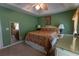 Green-painted bedroom with large windows and a ceiling fan at 40 Oak Hill Dr, Covington, GA 30016