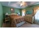 Green-painted bedroom with large windows and a ceiling fan at 40 Oak Hill Dr, Covington, GA 30016