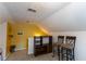 Spacious bonus room with a bookshelf and seating area with two barstools at 40 Oak Hill Dr, Covington, GA 30016