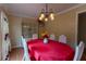 Dining room featuring chandelier, view of decorative cabinet, and seating for four at 40 Oak Hill Dr, Covington, GA 30016