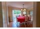 Elegant dining room with chandelier, access to outdoor patio, and bright natural light at 40 Oak Hill Dr, Covington, GA 30016