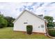 Exterior view of the home with white siding, a small yard, and a clear sky backdrop at 40 Oak Hill Dr, Covington, GA 30016