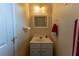 A half bathroom featuring a vanity with mirror and towel rack at 40 Oak Hill Dr, Covington, GA 30016