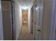 Long hallway with carpet and multiple doors leading to other rooms at 40 Oak Hill Dr, Covington, GA 30016